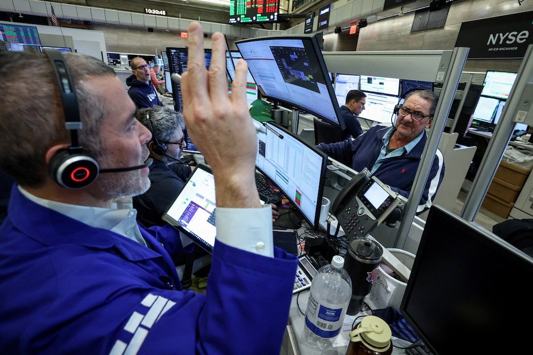 1/3]Futures-options traders work on the floor at the New York Stock Exchange's NYSE American (AMEX) in New York City, U.S., January 15, 2026. REUTERS/Brendan McDermid